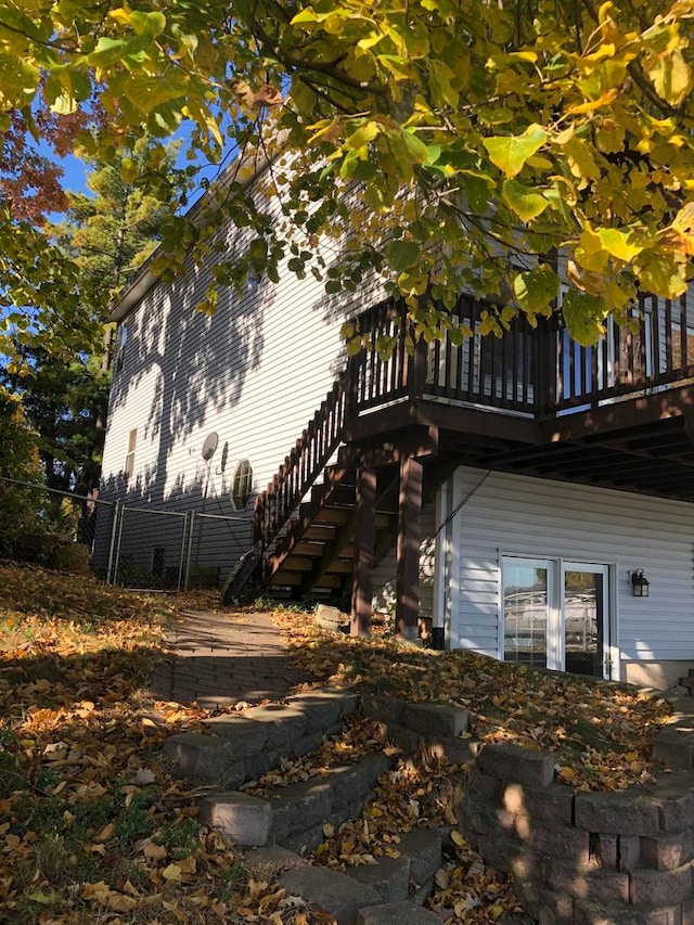 view of property exterior featuring a wooden deck