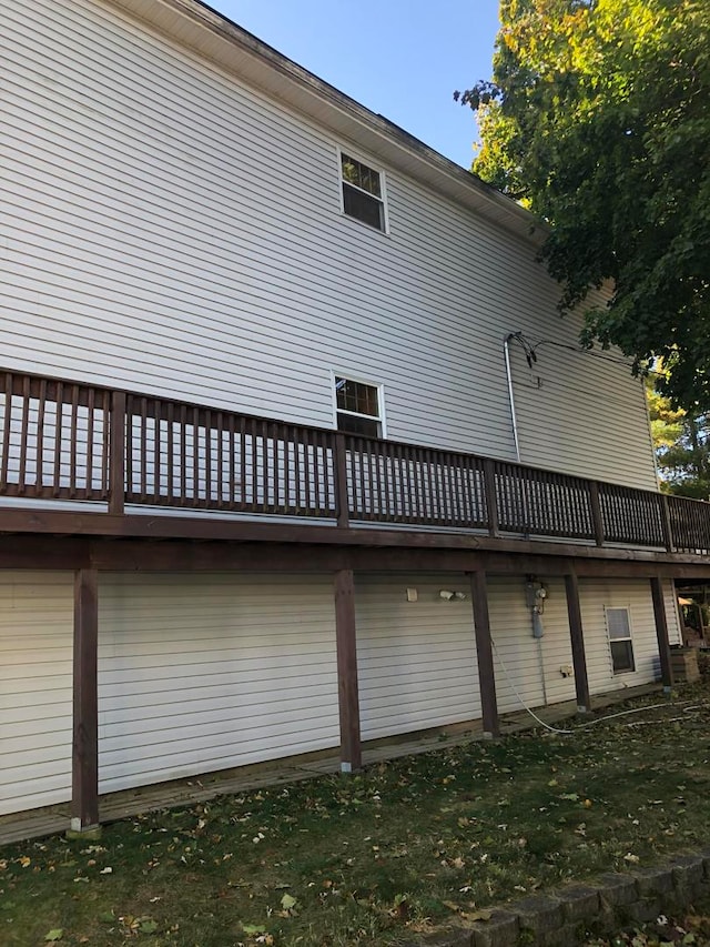 view of home's exterior featuring a wooden deck