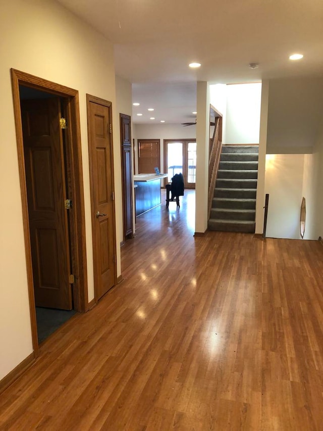 corridor featuring dark hardwood / wood-style flooring