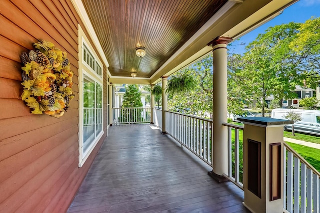 wooden terrace featuring a porch