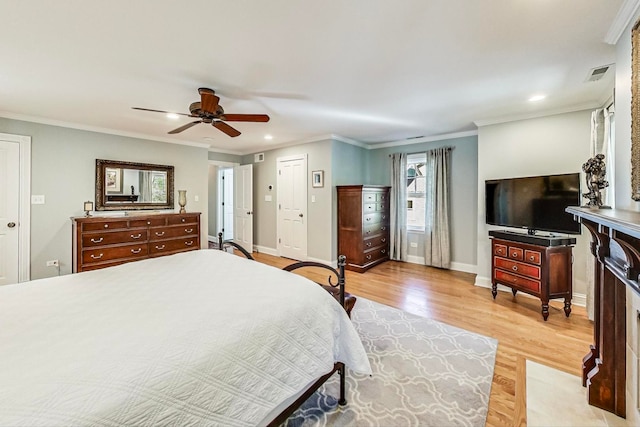 bedroom with ceiling fan, ornamental molding, and light wood-type flooring