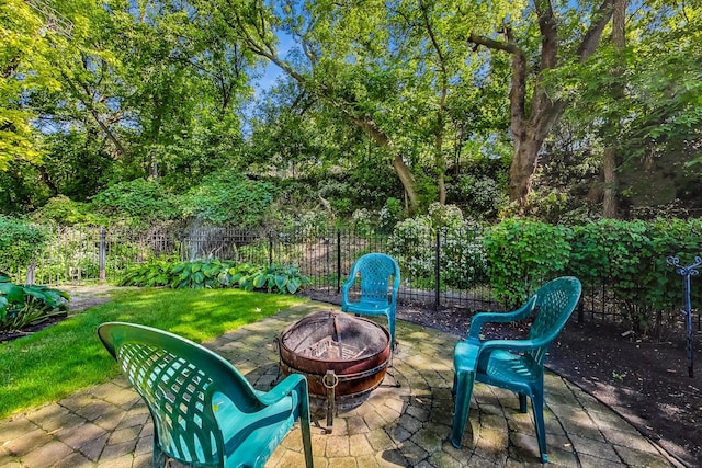 view of patio / terrace with a fire pit