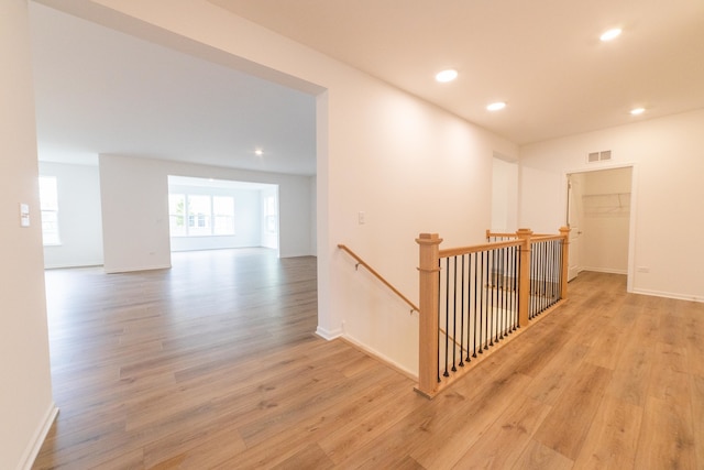 hall with light wood-type flooring