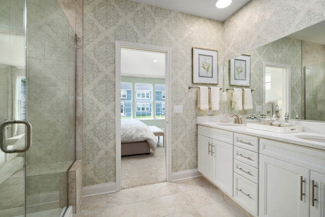 bathroom with tile patterned flooring, vanity, and a shower with door