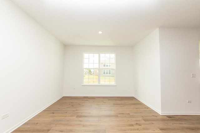 unfurnished room featuring light hardwood / wood-style floors