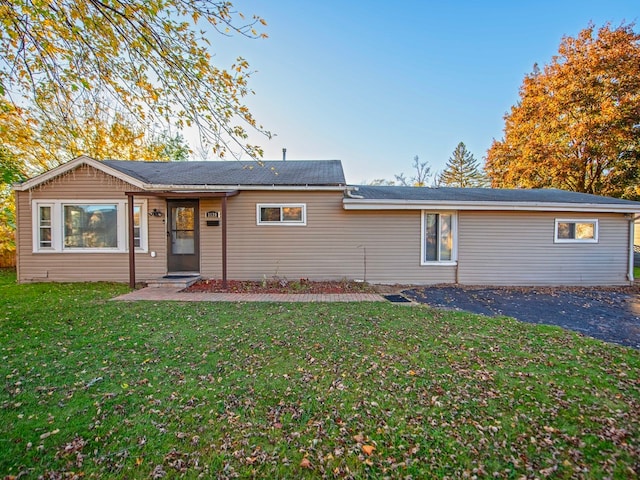 rear view of house with a yard