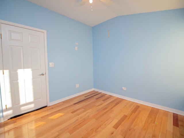 unfurnished room featuring light wood-type flooring, ceiling fan, and vaulted ceiling