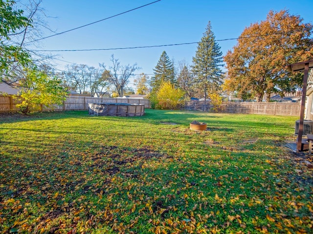 view of yard with central AC