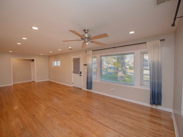 unfurnished room with ceiling fan and light hardwood / wood-style flooring