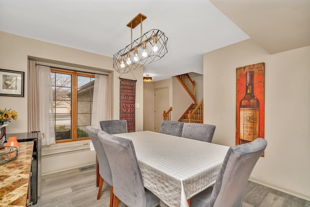 dining space featuring light hardwood / wood-style flooring