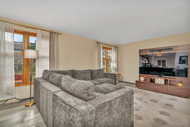 living room with plenty of natural light and light hardwood / wood-style floors