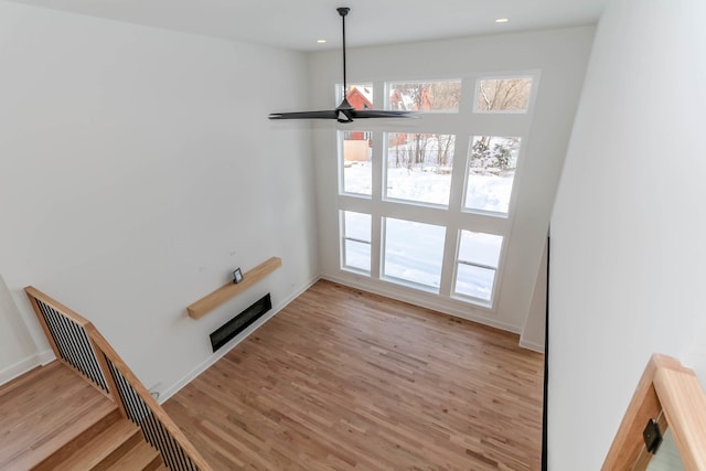 unfurnished dining area featuring light hardwood / wood-style flooring and ceiling fan