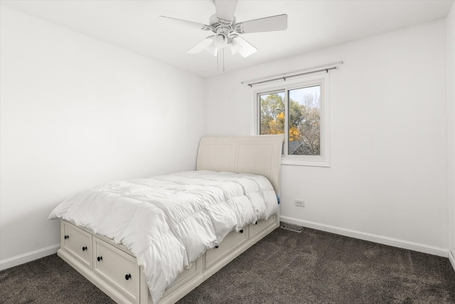 bedroom with dark carpet and ceiling fan