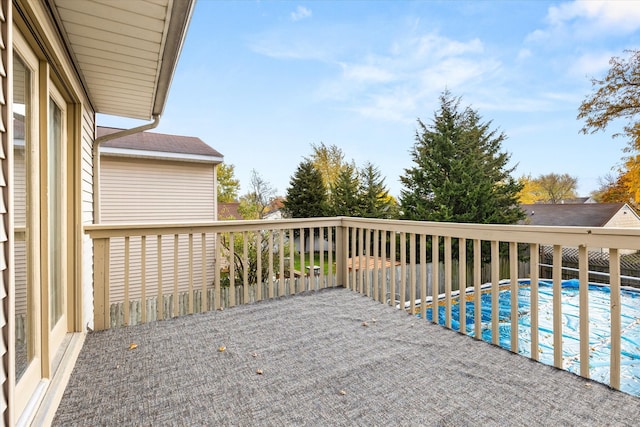 deck featuring a covered pool