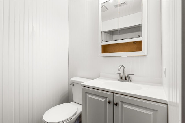 bathroom with vanity and toilet