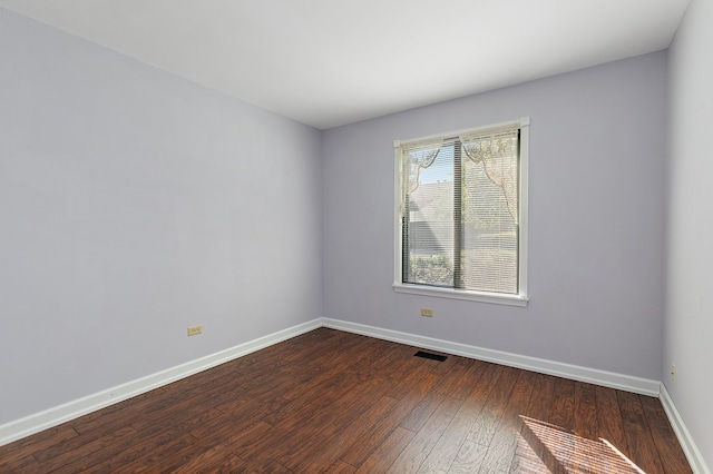 spare room featuring hardwood / wood-style flooring