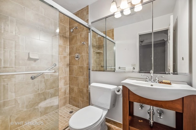 bathroom featuring sink, an enclosed shower, and toilet