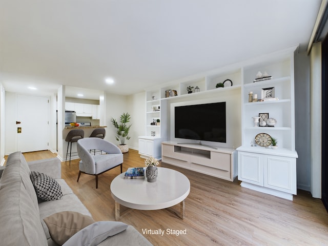 living room with light hardwood / wood-style floors