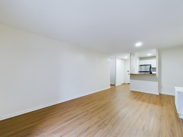 unfurnished living room featuring light hardwood / wood-style floors