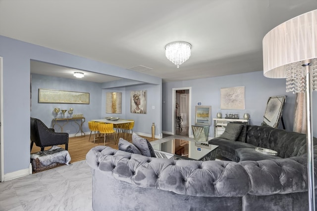 living room featuring a chandelier