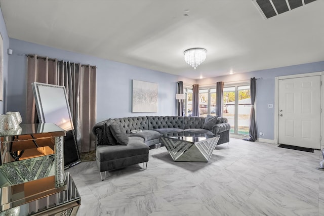 living room with a notable chandelier