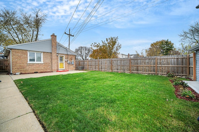 view of yard with central AC unit