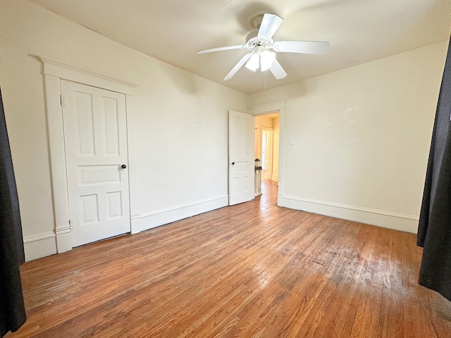 unfurnished bedroom with ceiling fan and light hardwood / wood-style floors