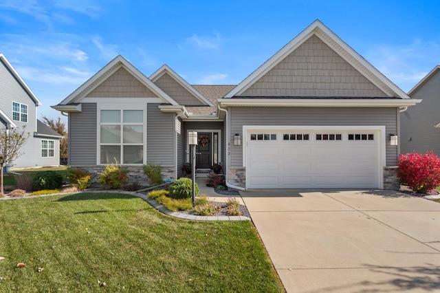 craftsman inspired home featuring a front yard and a garage