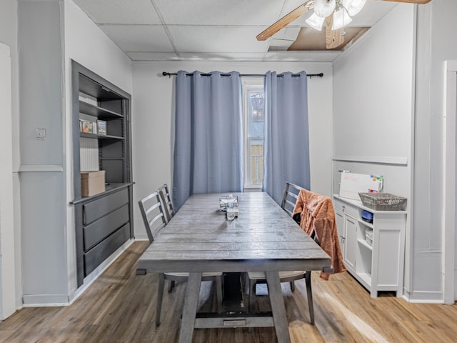 dining room featuring wood-type flooring and ceiling fan