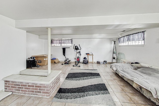 workout room with tile patterned flooring and plenty of natural light