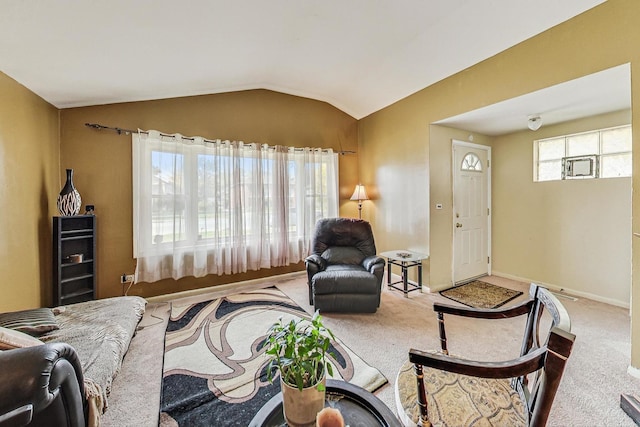 living room featuring carpet flooring and vaulted ceiling