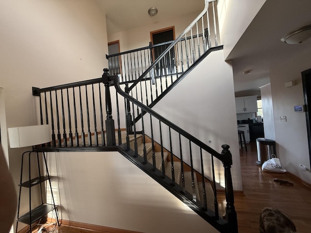 staircase featuring hardwood / wood-style flooring