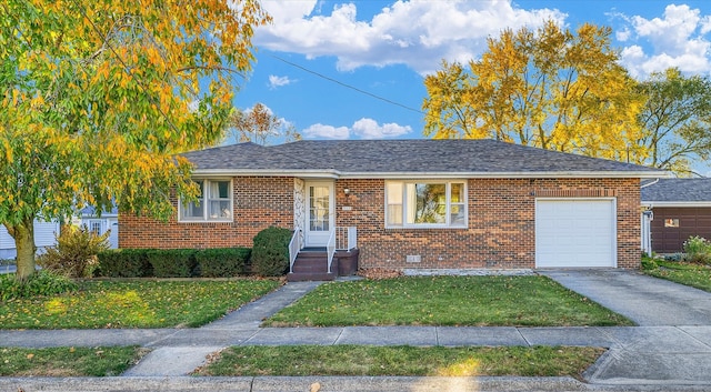 single story home featuring a garage and a front lawn