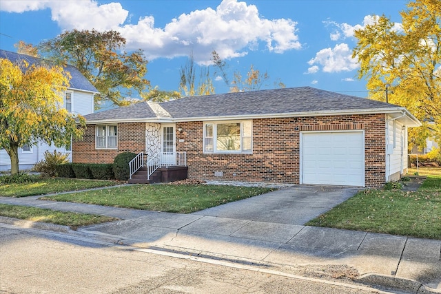 view of front of home featuring a garage and a front yard