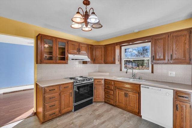 kitchen featuring decorative light fixtures, stove, sink, dishwasher, and baseboard heating