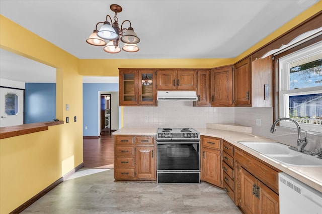 kitchen with sink, tasteful backsplash, dishwashing machine, electric range, and pendant lighting