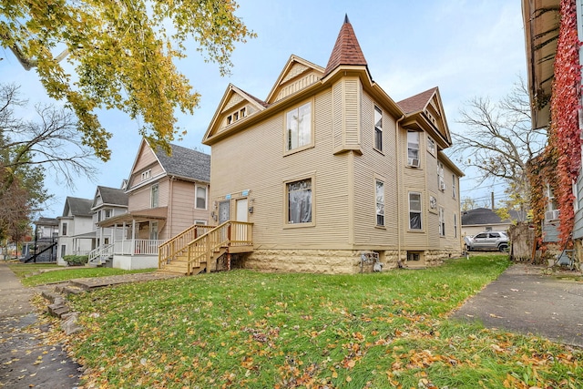 view of home's exterior featuring a yard