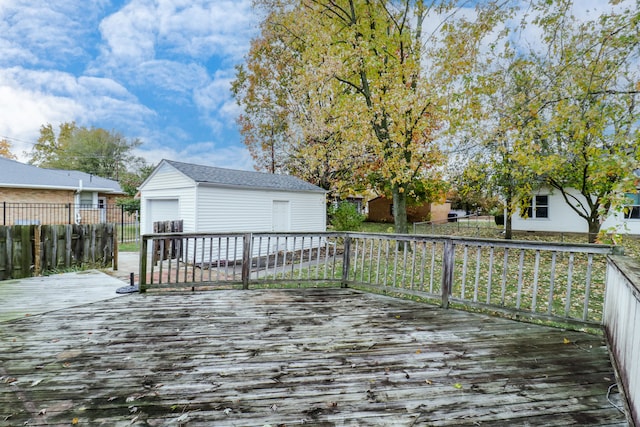 wooden terrace featuring an outbuilding