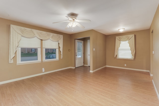 empty room featuring light hardwood / wood-style floors and ceiling fan