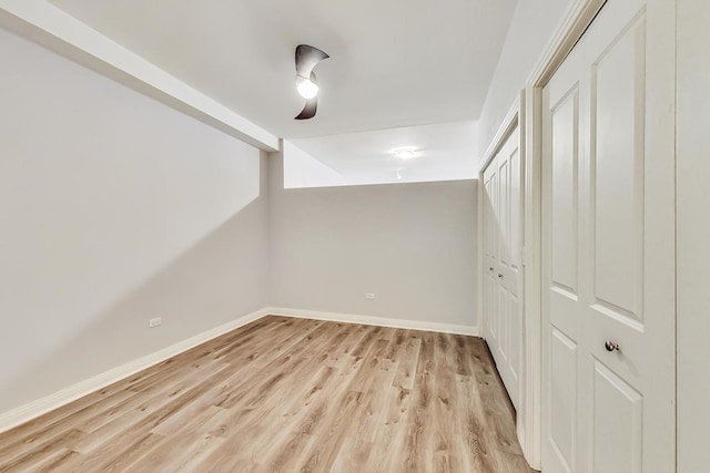 bonus room with light wood-type flooring and baseboards