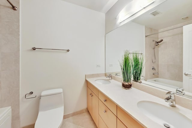 bathroom featuring toilet, visible vents, a sink, and shower / bathtub combination