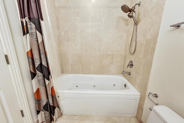 full bathroom with a combined bath / shower with jetted tub, toilet, and tile patterned floors