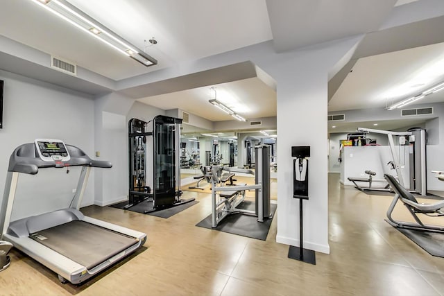 workout area with baseboards and visible vents