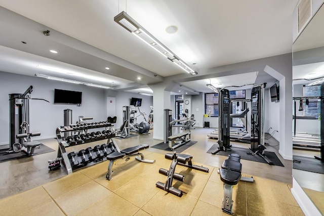 gym with recessed lighting and baseboards