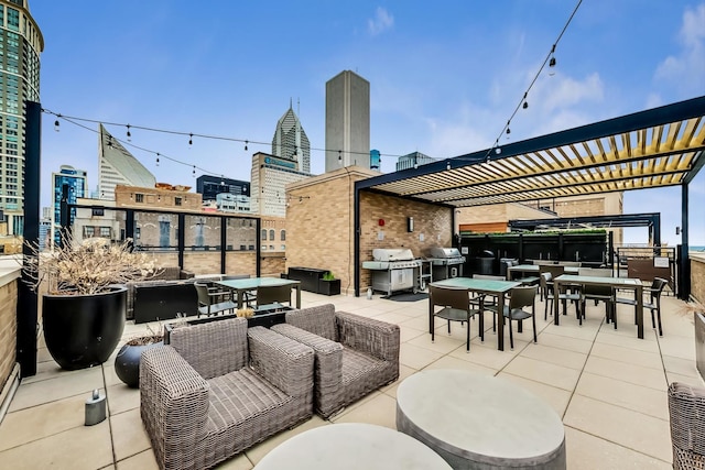 view of patio / terrace with outdoor dining space, a city view, and an outdoor living space