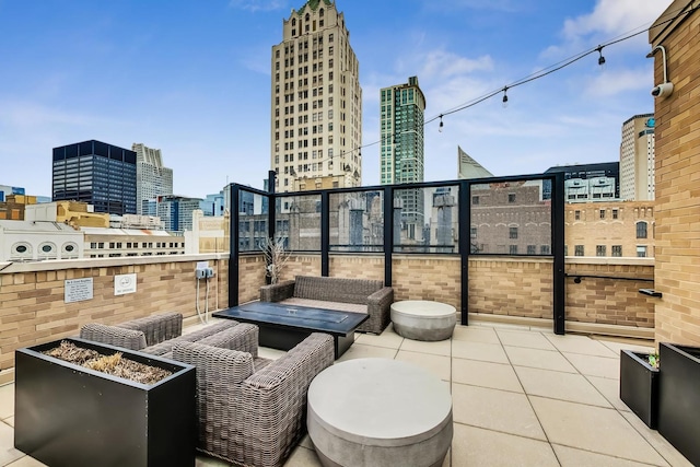 view of patio featuring outdoor lounge area and a city view