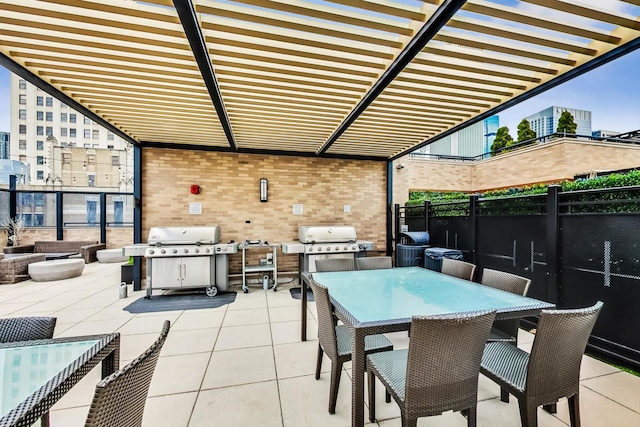 view of patio featuring a grill, fence, a pergola, and outdoor dining space