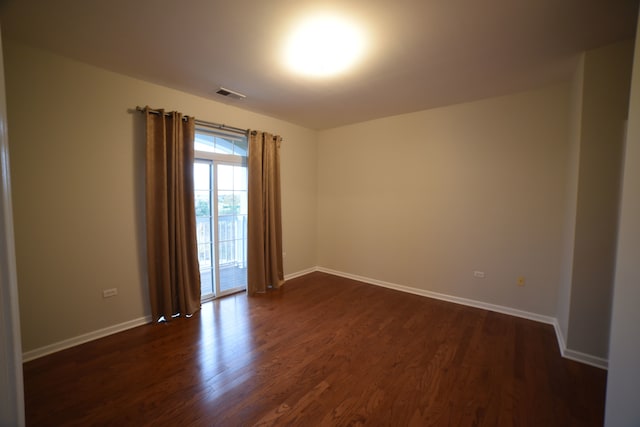 empty room featuring dark hardwood / wood-style floors