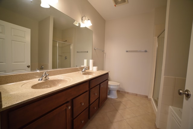 bathroom with walk in shower, tile patterned flooring, vanity, and toilet