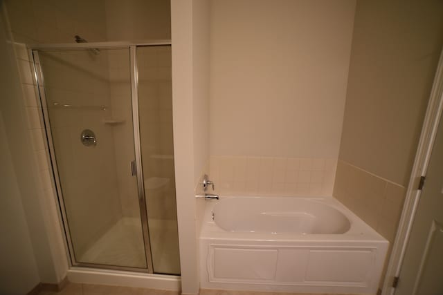 bathroom with separate shower and tub